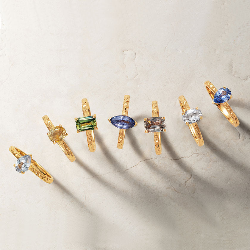 Lebrusan Studio's Fancy Athena collection of ethical engagement rings with hand-engraving, recycled gold bands and rainbow gemstones