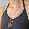 Reclaimed Vintage necklace with a red leaf-shaped carnelian quartz pendant, reclaimed antique Victorian gold chain and T-bar clasp, modelled on body 2