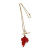 Gold Reclaimed Vintage necklace with a red leaf-shaped carnelian quartz pendant, reclaimed antique Victorian gold chain and T-bar clasp on a white background - full chain view