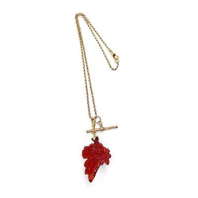 Gold Reclaimed Vintage necklace with a red leaf-shaped carnelian quartz pendant, reclaimed antique Victorian gold chain and T-bar clasp on a white background - full chain view