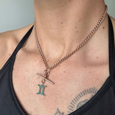 Rose gold reclaimed antique Victorian chain necklace necklace with an ethical green emerald Gemini pendant, modelled on body