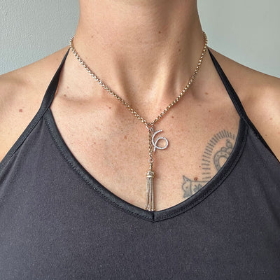 Reclaimed Vintage unique necklace with antique Victorian 9ct gold tassel pendant, 9ct recycled gold chain and a new numerology pendant crafted in recycled gold and conflict-free diamonds, modelled on body 2