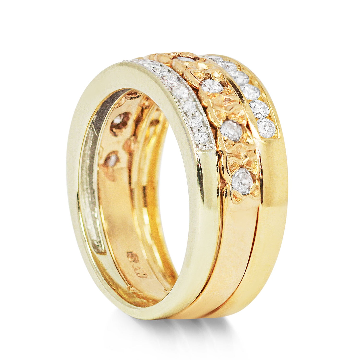 Three antique 9ct gold Victorian eternity rings half-set with diamonds, soldered together into a chunky stack, side view