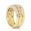Three antique 9ct gold Victorian eternity rings half-set with diamonds, soldered together into a chunky stack, side view