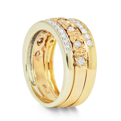 Three antique 9ct gold Victorian eternity rings half-set with diamonds, soldered together into a chunky stack, side view