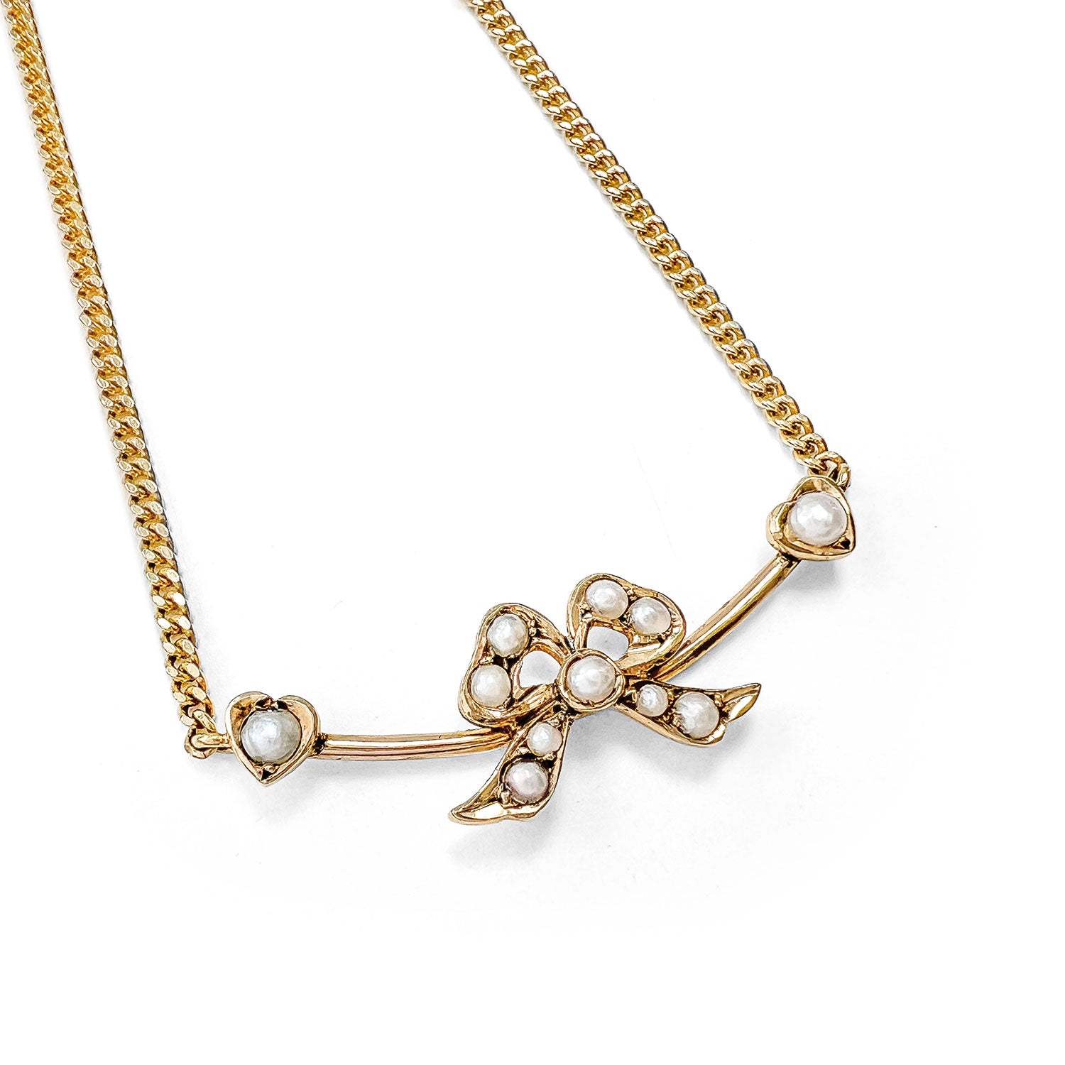 Reclaimed Vintage antique Victorian ribbon pearl brooch on a slim reclaimed 9ct gold necklace 