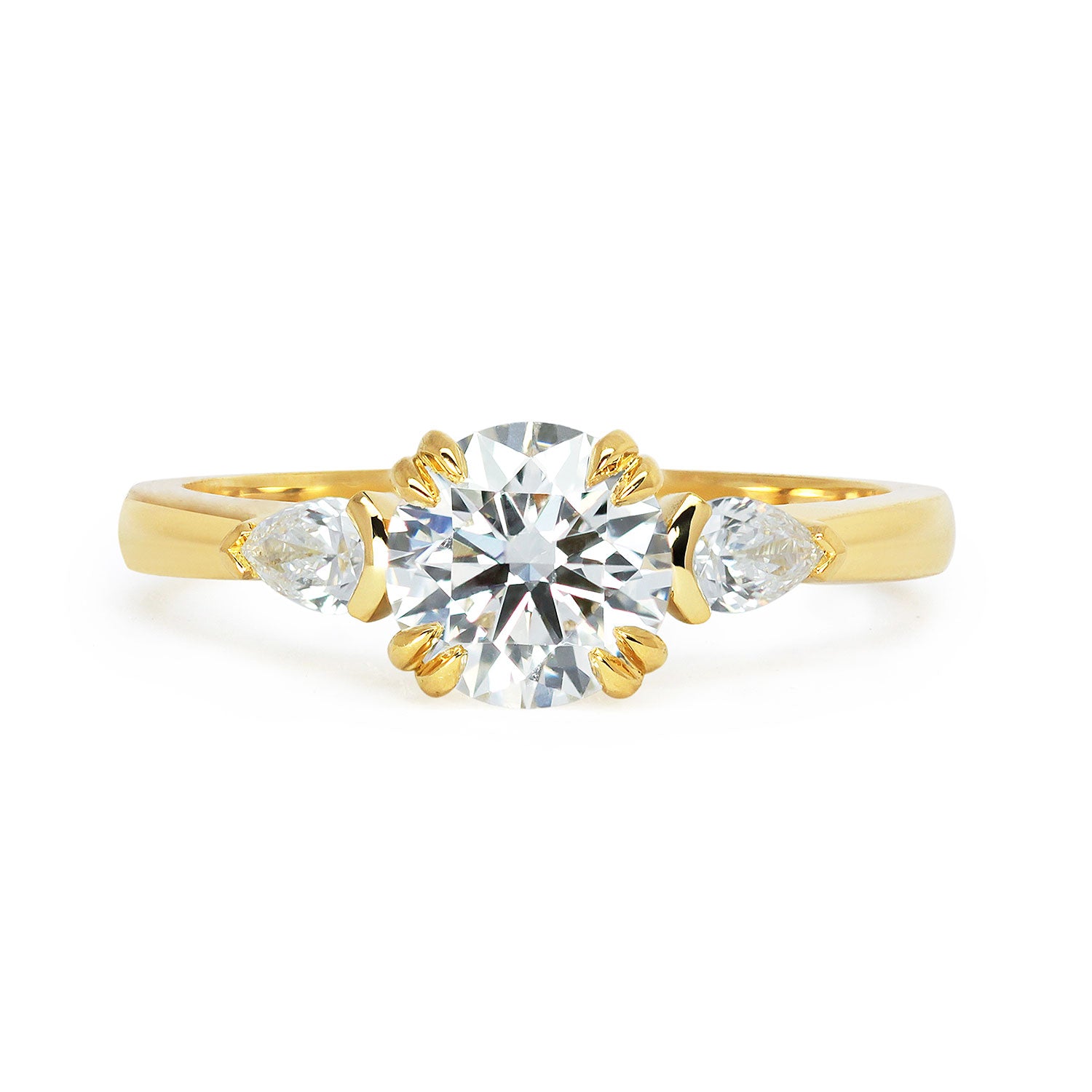 Mark Dearing's bespoke lab-grown diamond trilogy engagement ring with pear-cut artisanal Ocean Diamonds side stones