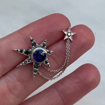 Bespoke Ev asymmetric stud earrings in 18ct recycled white gold with blue fair-traded sapphires and black diamonds video