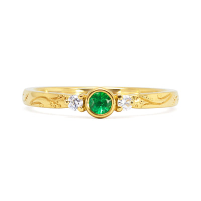Bespoke Andrew hand-engraved trilogy engagement ring - 18ct recycled yellow gold, South African fair-traded emerald and traceable Canadian side diamonds