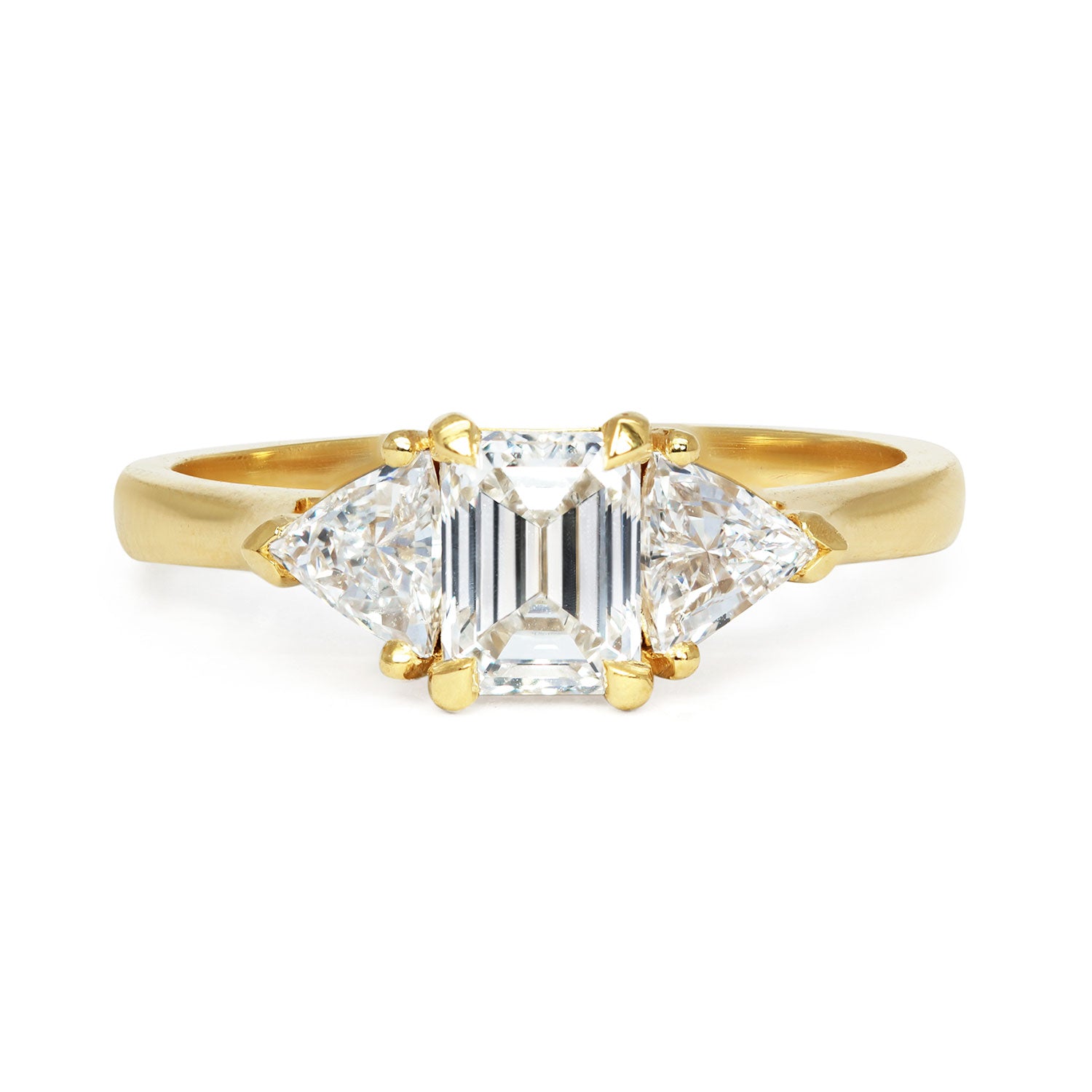 Bespoke Steve trilogy engagement ring, 18ct yellow Fairmined Ecological Gold, 0.7ct Canadamark emerald-cut diamond and trillion-cut artisanal Ocean Diamonds