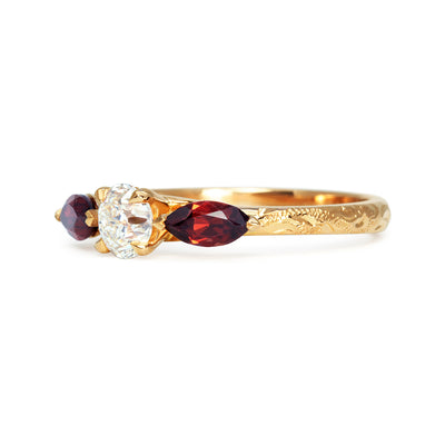 Bespoke Craig ethical trilogy engagement ring, recycled old-cut diamond, fair-traded and conflict-free marquise-cut garnets and 18ct rose Fairmined Ecological Gold side