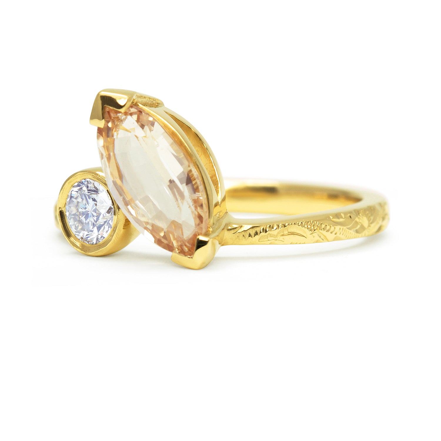 Bespoke Matt toi et moi engagement ring, champagne Sri Lankan marquise sapphire, recycled brilliant-cut diamond and 18ct yellow Fairtrade Gold side view