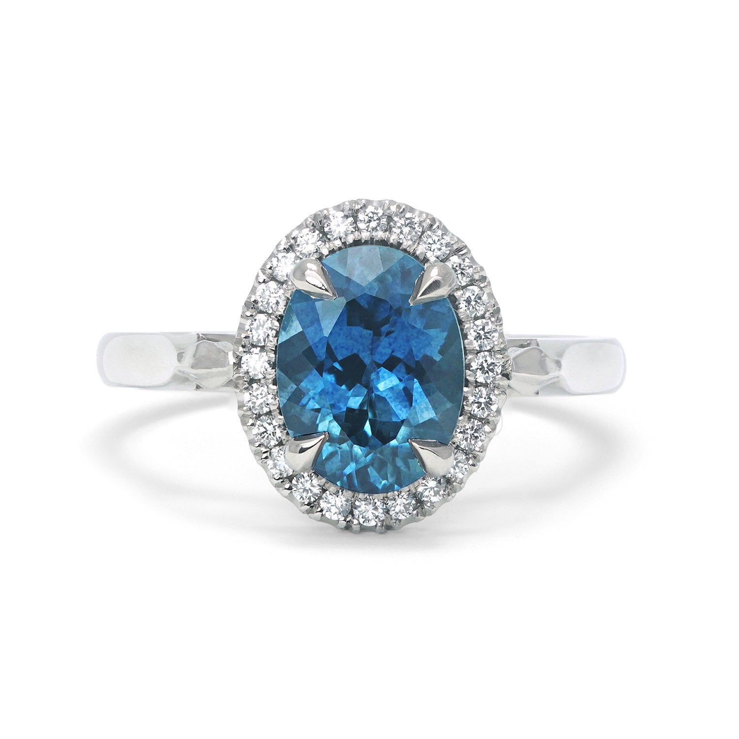 Bespoke Robert Ethical Sapphire Halo Engagement Ring, 100% recycled platinum, conflict-free Canadian diamonds and an oval-cut fair-traded Malawi sapphire