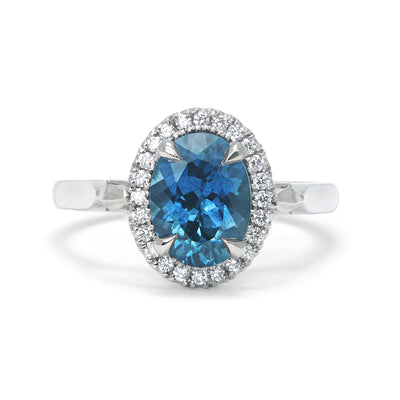 Bespoke Robert Ethical Sapphire Halo Engagement Ring, 100% recycled platinum, conflict-free Canadian diamonds and an oval-cut fair-traded Malawi sapphire
