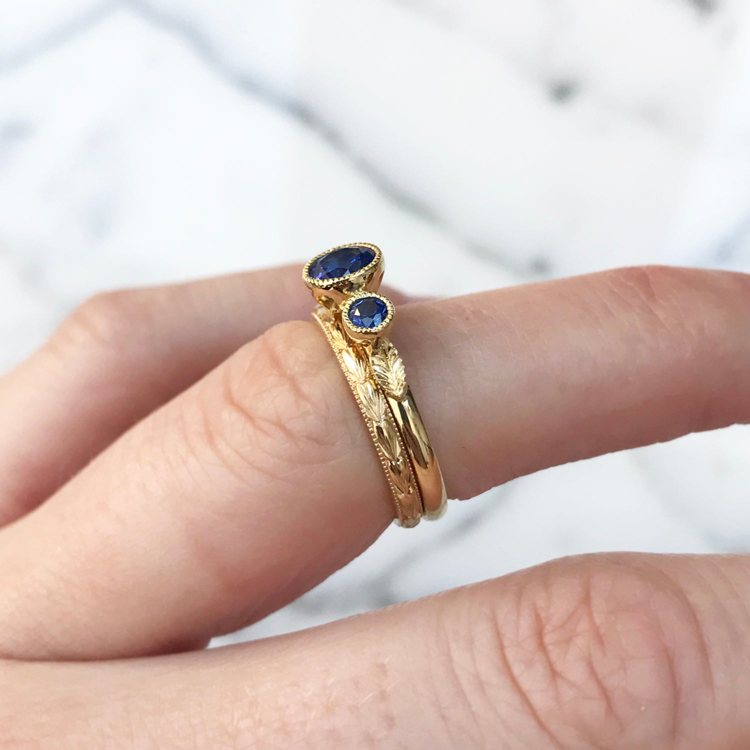 Bespoke ethical sapphire trilogy engagement ring, 18ct recycled yellow gold and traceable Sri Lankan sapphires lifestyle 