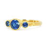 Bespoke ethical sapphire trilogy engagement ring, 18ct recycled yellow gold and traceable Sri Lankan sapphires side
