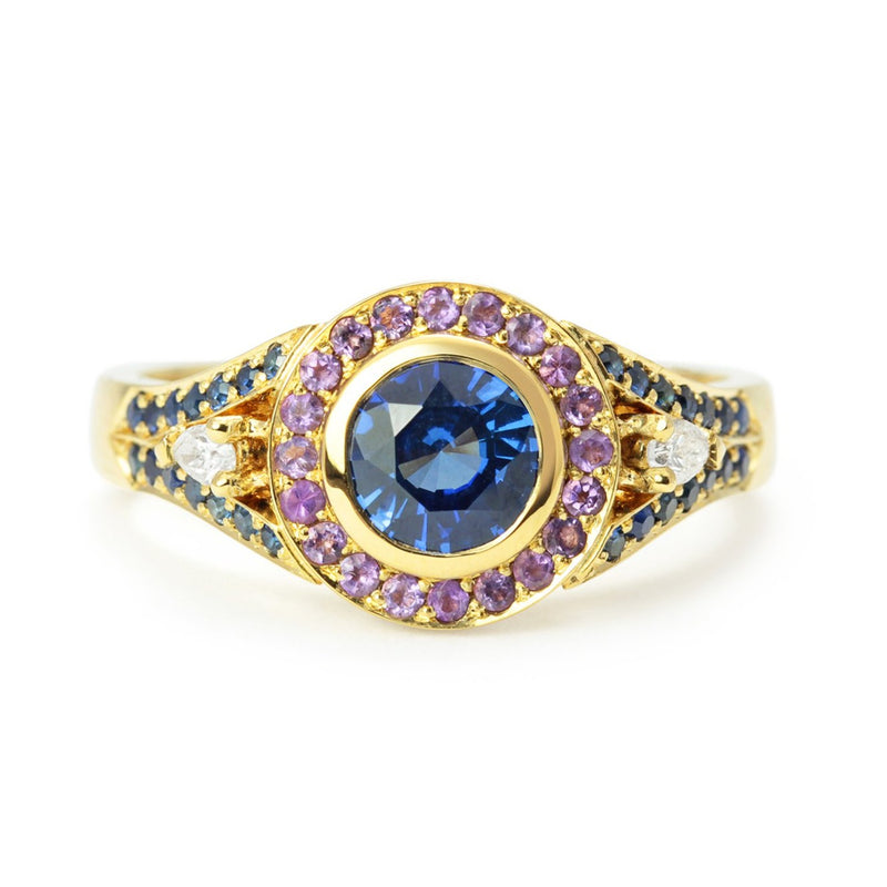 Bespoke Laura engagement ring with a 0.9ct blue Sri Lankan sapphire, blue Australian sapphires, pear-cut conflict-free African diamonds, fair-traded amethyst and 18ct yellow Fairtrade Gold 