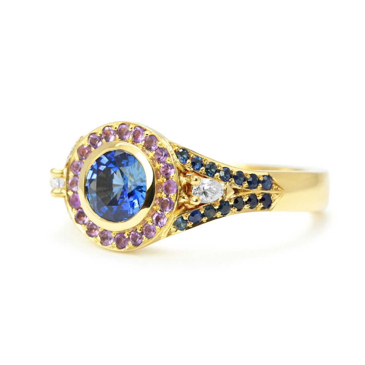 Bespoke Laura engagement ring with a 0.9ct blue Sri Lankan sapphire, blue Australian sapphires, pear-cut conflict-free African diamonds, fair-traded amethyst and 18ct yellow Fairtrade Gold 