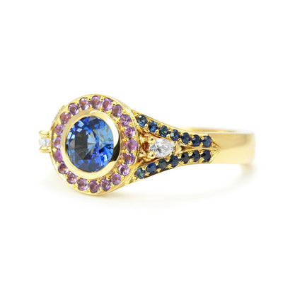 Bespoke Laura engagement ring with a 0.9ct blue Sri Lankan sapphire, blue Australian sapphires, pear-cut conflict-free African diamonds, fair-traded amethyst and 18ct yellow Fairtrade Gold