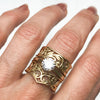 Artisan Filigree Ethical Gold Commitment Ring on hand, stacked with Artisan solitaire engagement ring and Filigree Artisan Wishbone ring