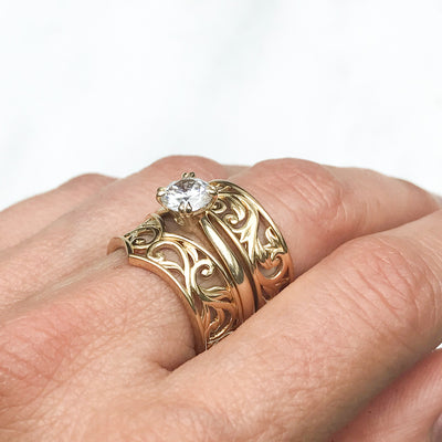 Artisan Filigree Ethical Gold Commitment Ring on hand, stacked with Artisan solitaire engagement ring and Filigree Artisan Wishbone ring, side