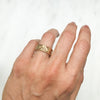 Artisan Filigree Ethical Gold Commitment Ring on hand, top