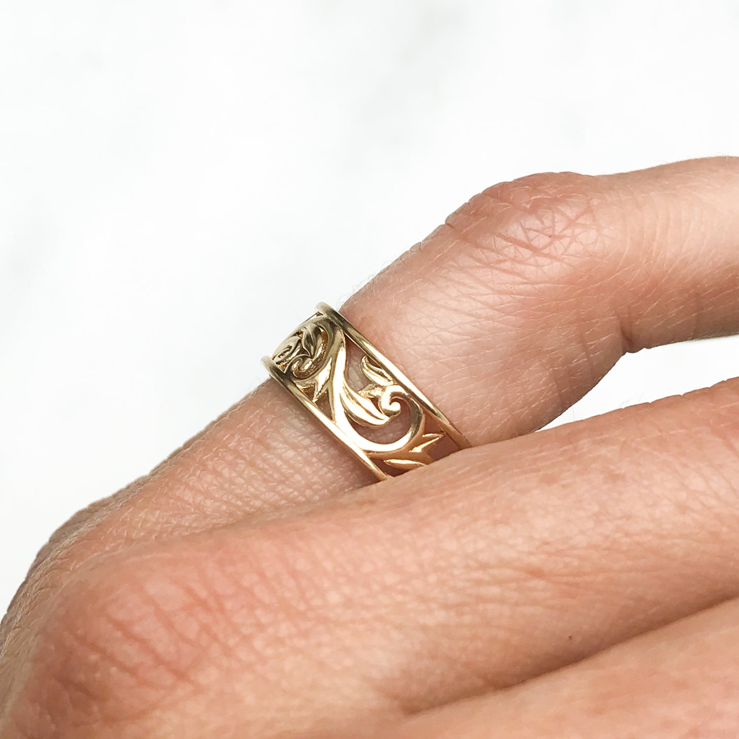 Artisan Filigree Ethical Gold Commitment Ring on hand, side
