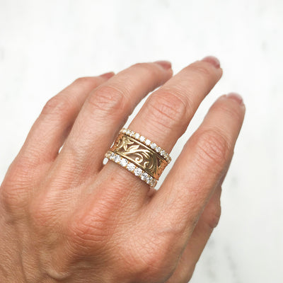 Artisan Filigree Ethical Gold Commitment Ring on hand, stacked with Altair commitment rings micro-set with conflict-free diamonds