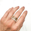 Artisan Filigree Ethical Gold Commitment Ring on hand, stacked with Altair micro-set conflict-free diamond commitment ring