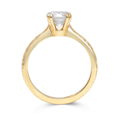 Lebrusan Studio Artisan Ethical Diamond Solitaire Engagement Ring, 1ct brilliant-cut Ocean Diamond, 18ct yellow Fairmined Ecological Gold and hand-engraving, side view