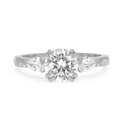 Lebrusan Studio Artisan Trilogy Engagement Ring, 1ct Ocean Diamond, 0.3ct pear-cut side Ocean Diamonds, 18ct white Fairmined Ecological Gold, hand engraving