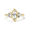 Theia ethical engagement ring, fair-traded white Sri Lankan sapphires and 18ct recycled yellow gold