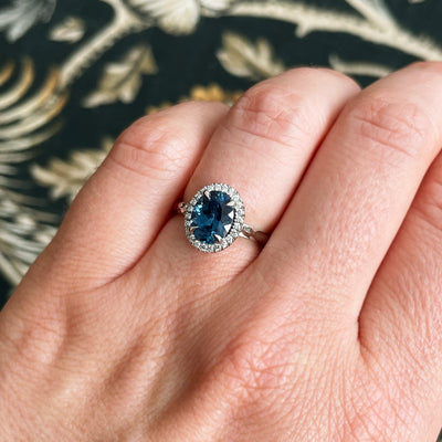 Bespoke Robert Ethical Sapphire Halo Engagement Ring, 100% recycled platinum, conflict-free Canadian diamonds and an oval-cut fair-traded Malawi sapphire 5
